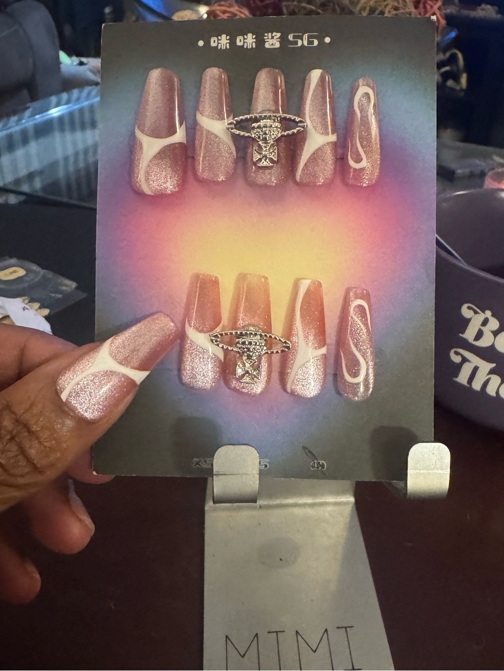 Shimmery Rose Gold Press-On Nails with White Swirl Accent (Long Coffin)